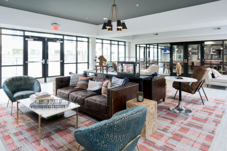 Resident Lounge with a variety of seating at the red apartments