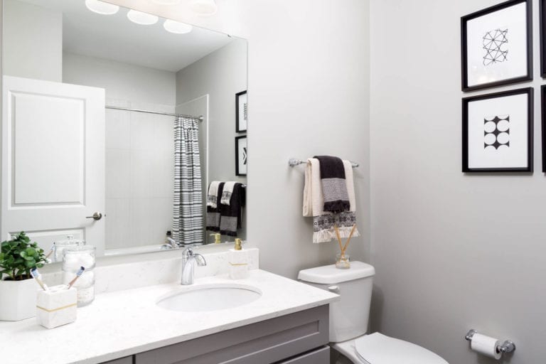 theRED Apartments luxury bathroom with granite counter tops