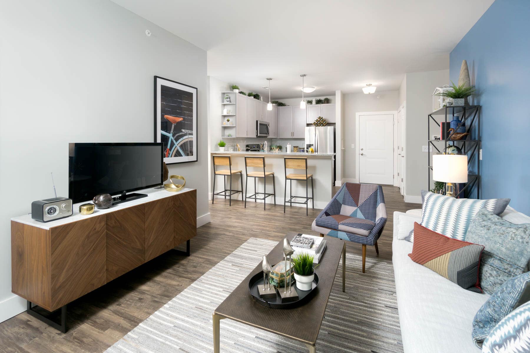 Open living and kitchen area with breakfast bar at the RED Apartments